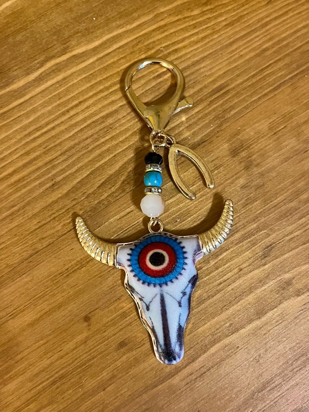 Southwestern bull with horns skeleton bag tag on gold tone lobster clasp 4”